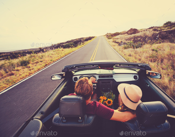 Happy Couple Driving in Convertible - Stock Photo - Images
