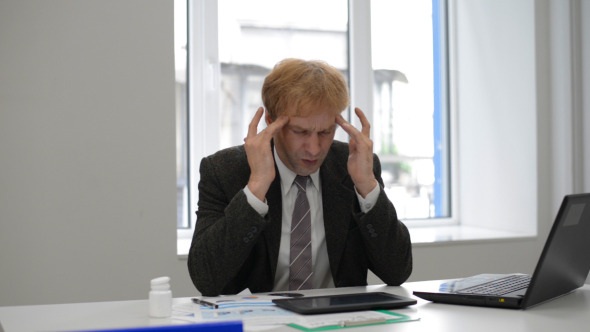 Businessman with Headache Trying to get Relax Businessman with Headache Trying to get Relax