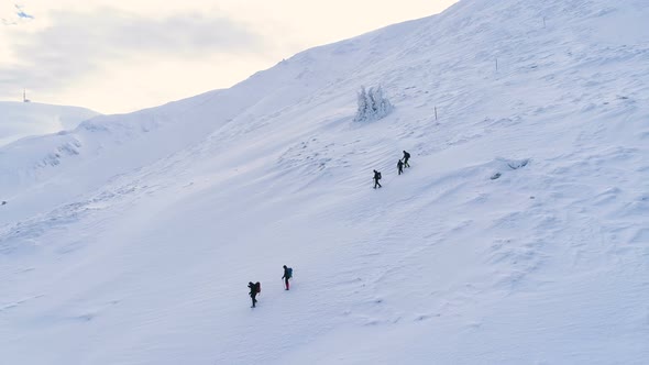 Team of Climbers Hung with Special Equipment Hiking Down from The Botev Peak in Bulgaria alt