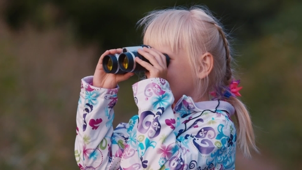 A Girl Looks In Binoculars A Girl Looks In Binoculars