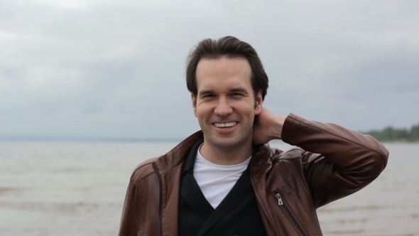 Guy Smiles Amid The Ocean