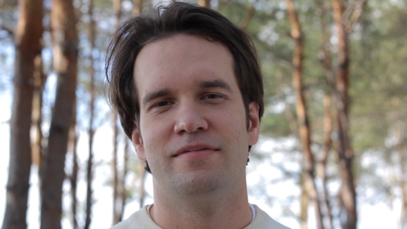 Smiling Man On The Forest Background