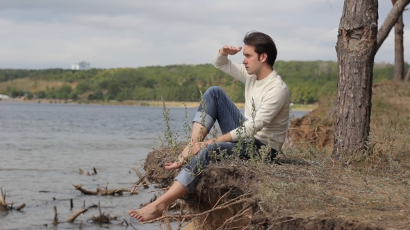 Man Looks Into The Distance To The Sea