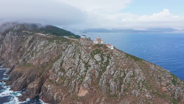 Drone Aerial Eis fly above Finisterre Lighthouse in Fisterra, Galicia, North of Spain, top notch vie alt