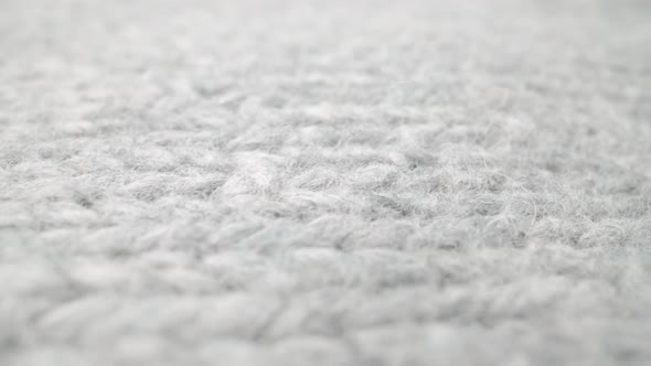 Extreme Detail View of Sheep Wool Cloth Texture Flowing in Macro Dolly Shot alt