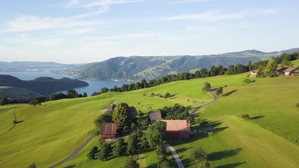 А Cozy Farm Located Among the Splendor of the Swiss Alps. Shooting From the Air.
