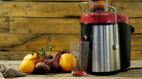 Juice maker pouring juice into glass 4k alt