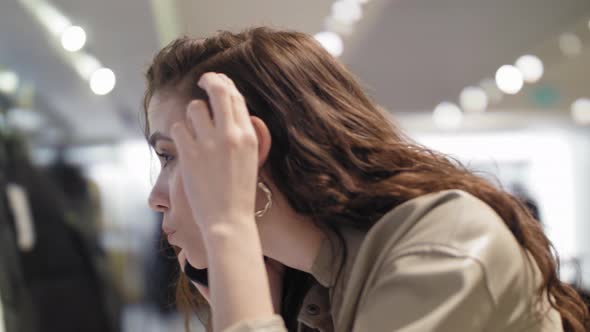 Talking on the Phone in a Shopping Mall