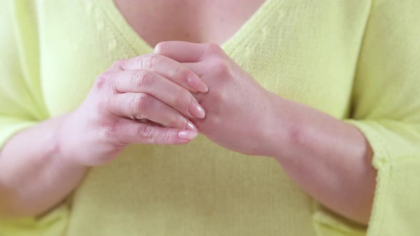 Closeup Hands of Unrecognizable Adult Caucasian Woman Taking Off Wedding Ring alt