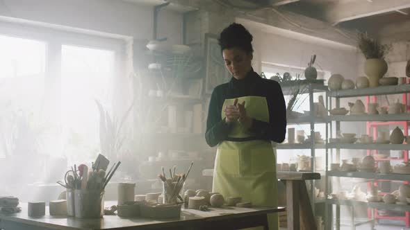 Beautiful Woman In Pottery Workshop alt