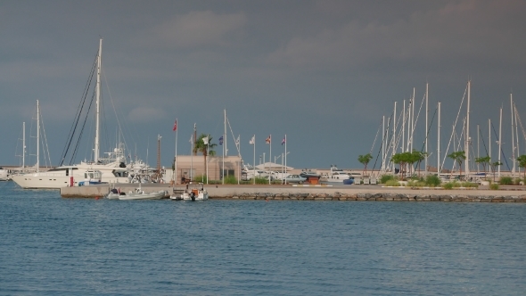 Sailing And Motor Superyachts Moored In Marina