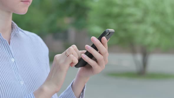 Close Up of Woman Using Smartphone Outdoor alt