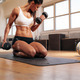 Fit woman working out at the gym with dumbbells stock photo