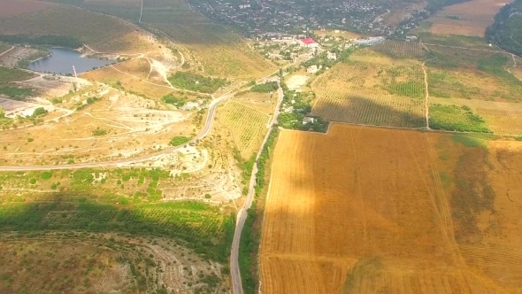 Bird's Eye Panorama Of Hilly Locality And Harvest