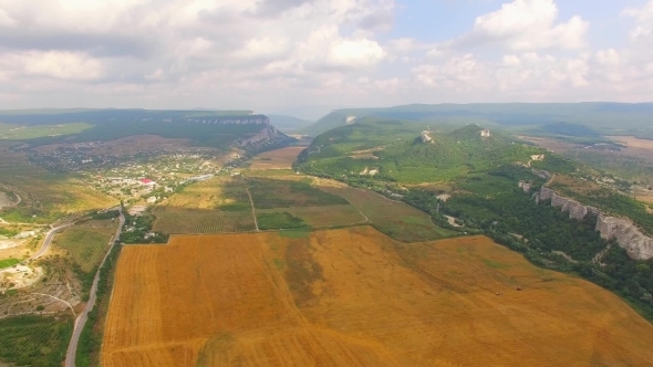 Bird's Eye Scenery Of Hilly Locality And Harvest