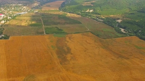 Aerial View Of Hilly Locality And Agricultural