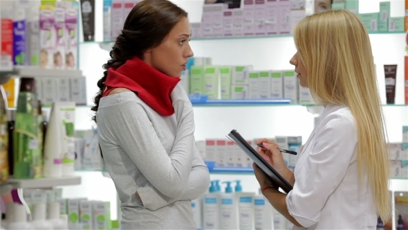 Pharmacist Helping Customer In Pharmacy Drugstore Pharmacist Helping Customer In Pharmacy Drugstore