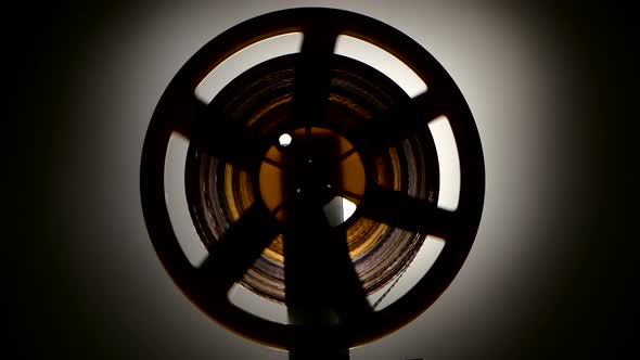 Fast Rewind the Film on the Old Retro Cinema Projector alt