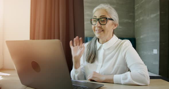 Woman Having Video Chat on Laptop