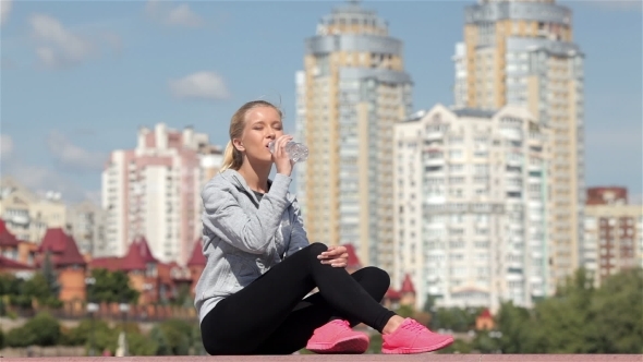 Young Girl Drinking Water After a Workout Young Girl Drinking Water After a Workout