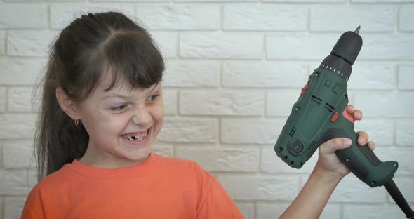 Smart child with screwdriver.  alt