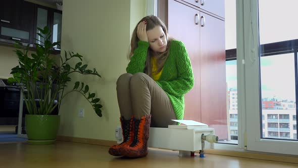 Woman Sit on Radiator and Froze Feet Turn More Heat in Room