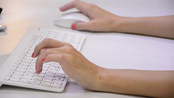 Girl Typing on the Keyboard