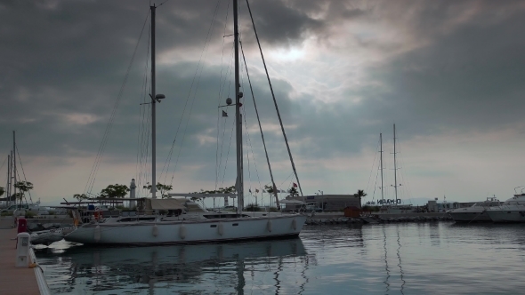 Sailing Ketch Moored In Marina At Calm Morning