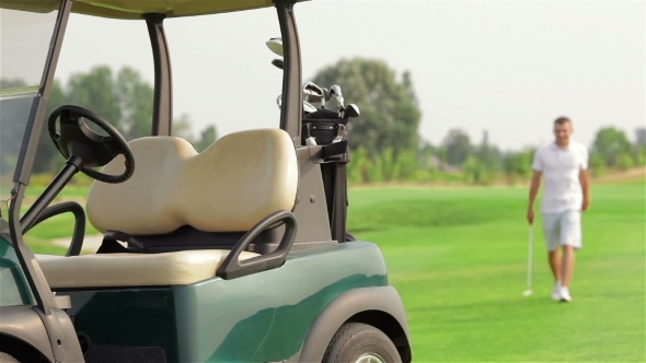 Golfer Getting In Golfcart alt