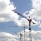 Cranes Working On Construction Site Under Cloudy - VideoHive Item for Sale