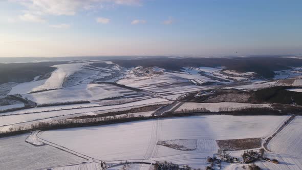 Aerial Drone View Fly Over the Snowy Field Winter Landscape
