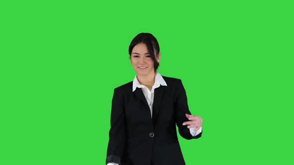 Brunette Businesswoman Dancing on a Green Screen, Chroma Key. alt