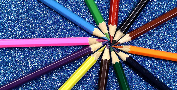 Colorful Pencils on Glittering Background