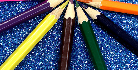 Colorful Pencils on Glittering Background 2