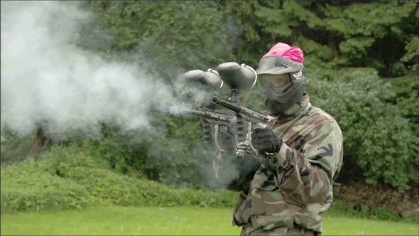 Two Paintball Guns are Being Fired Up 