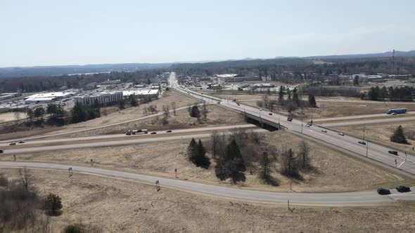 Overview of rural interstate highway interchange intersection in fall with dry grass and blue sky