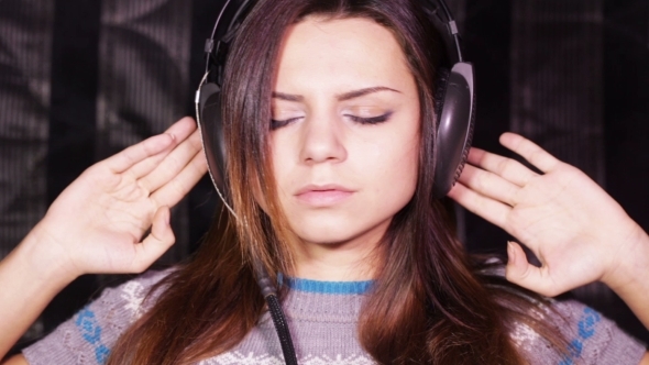 Girl With Headphones On Sofa Relax