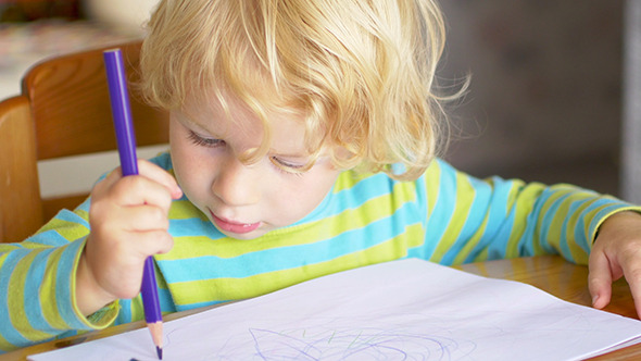 Little Boy Paints A Colorful Picture