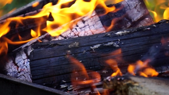 He Lit The Fire Burning Logs