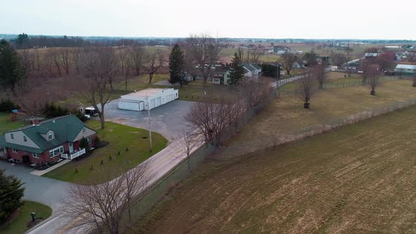 Aerial View of an Open Amish Horse and Buggy Trotting Along as Seen by a Drone alt