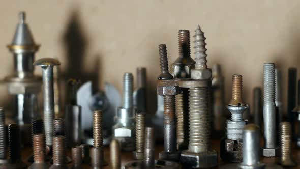 pile of bolts, screws on a workbench