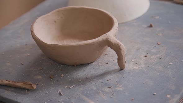 Close View of Pottery Equipment and Results of Shaping and Forming Working.