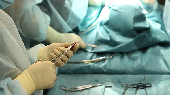 Hands Of A Surgical Nurse And Surgical Tools