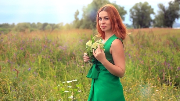 Romantic Red-haired Young Woman In Green Long