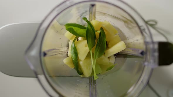 Spinach Leaves are Thrown Into Blender to Make Smoothie