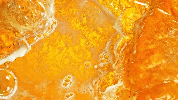 Super Slow Motion Shot of Rippling Fresh Beer Wave From Top Shot at 1000Fps. alt