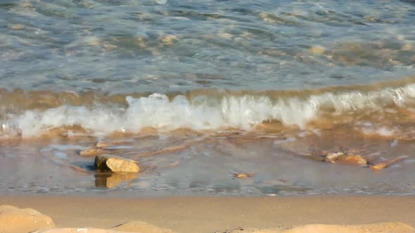 Turquoise Sea Water Waves And Stones 1 alt
