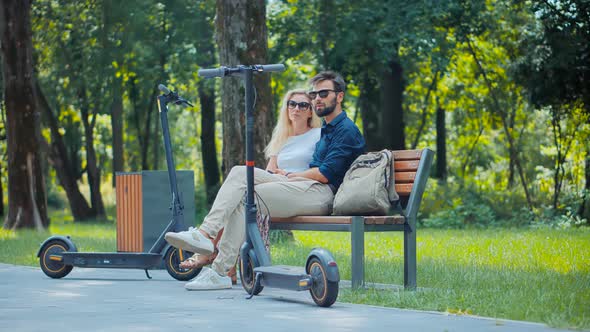 Transportation In City. Man Taking Electronic Scooter Share. E-Scooter Riding Eco Transport Ride. alt