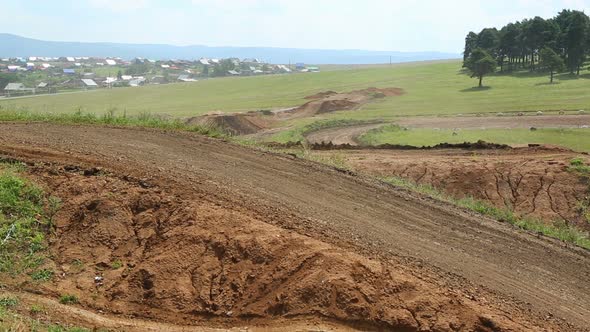Motocross Competition On A Hilly Road 1 alt