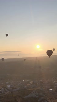 Vertical Video of Hot Air Balloons Flying in the Sky Over Cappadocia Turkey alt